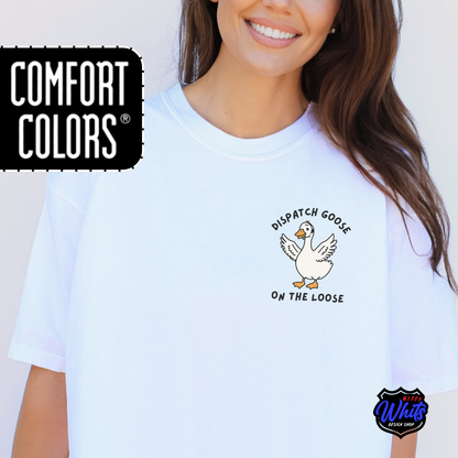 Person wearing a white Comfort Colors t-shirt with a 'Dispatch Goose on the Loose" graphic.