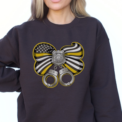 Black sweatshirt with a design featuring handcuffs, a badge, and an American flag on a white background.