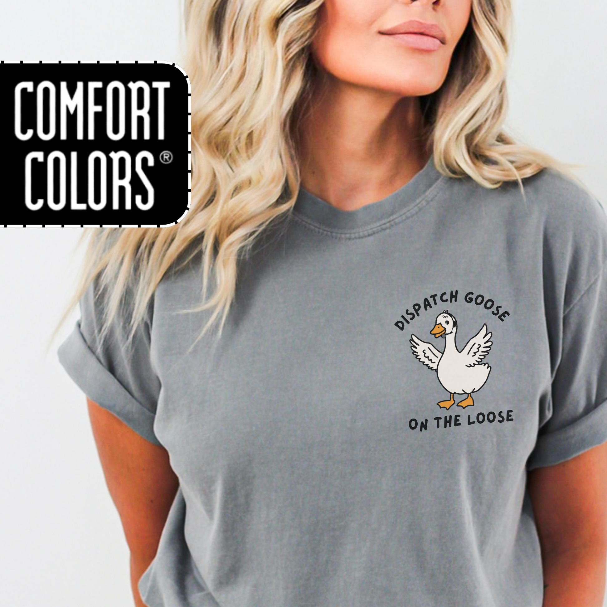 Person wearing a grey Comfort Colors t-shirt with a 'Dispatch Goose on the Loose" graphic.