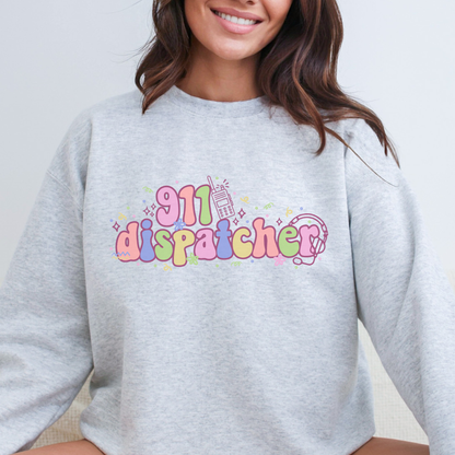 Person wearing a gray sweatshirt with '911 dispatcher' text in colorful letters.