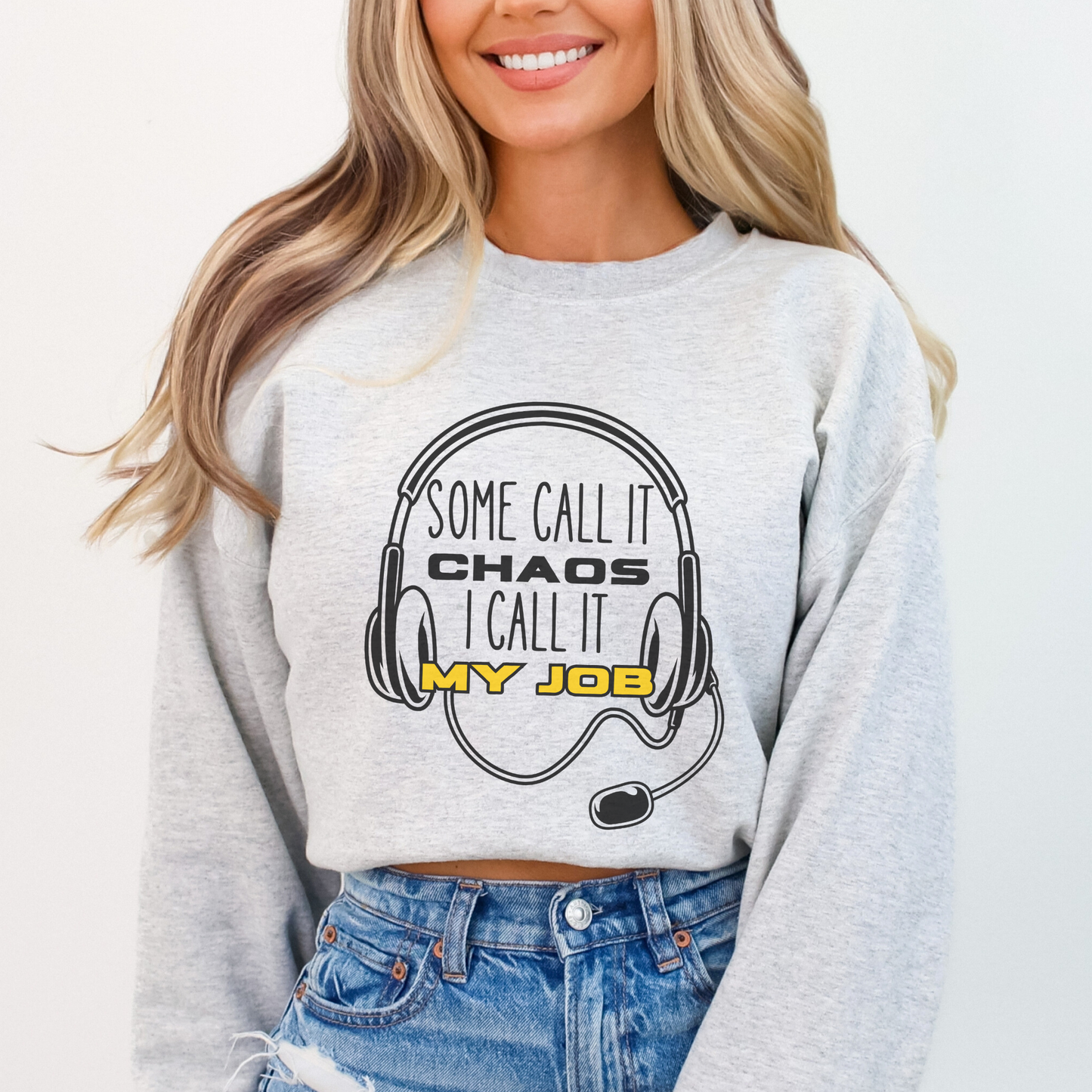 Person wearing a gray sweatshirt with a humorous design and text.