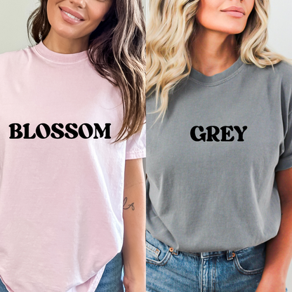 Two women wearing t-shirts labeled 'Blossom' and 'Grey'.