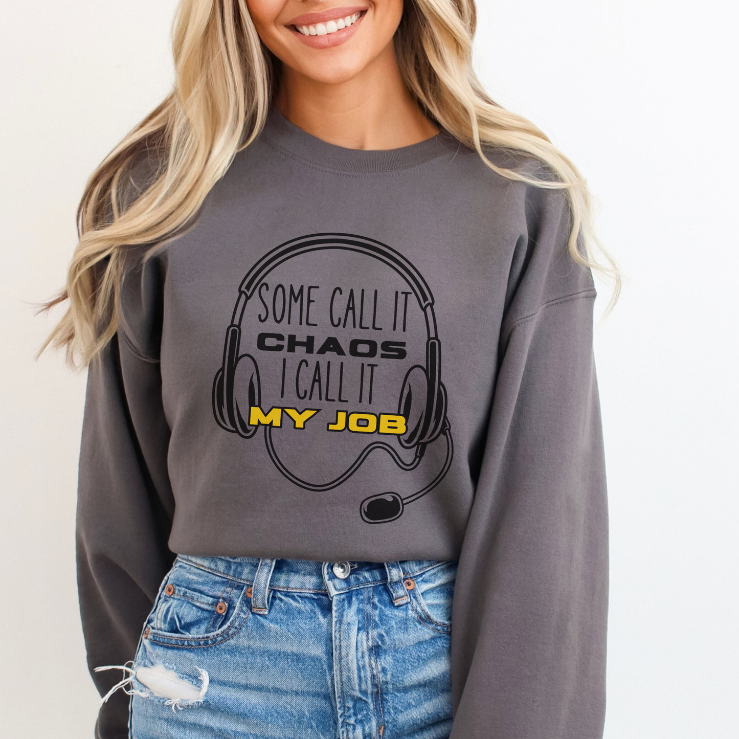 Person wearing a gray sweatshirt with a humorous design and text.