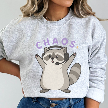 Gray sweatshirt with a raccoon graphic and 'CHAOS' text worn by a person.