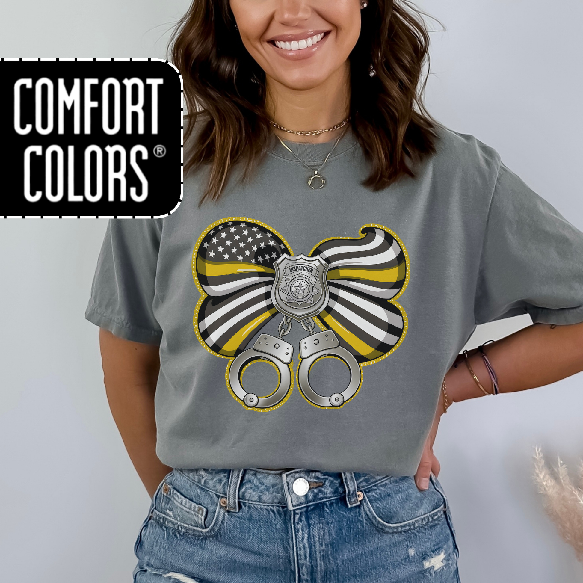 Person wearing a gray t-shirt with a graphic design and 'Comfort Colors' logo.