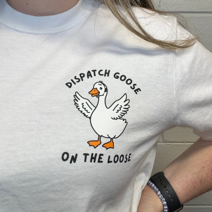 Person wearing a white Comfort Colors t-shirt with a 'Dispatch Goose on the Loose" graphic.